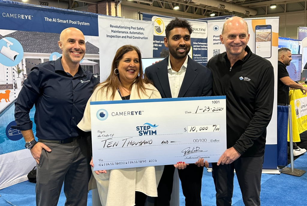  Olympic Gold Medalist Rowdy Gaines and Sabeena Hickman of PHTA receive a donation from CamerEye’s Sai Reddy and Michael Sparacio to help Step Into Swim gift grants to learn-to-swim providers across the country and fund swim lessons for 200 children while lowering the drowning rate.